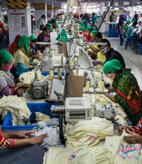 Factory hall garments factory, women sowing